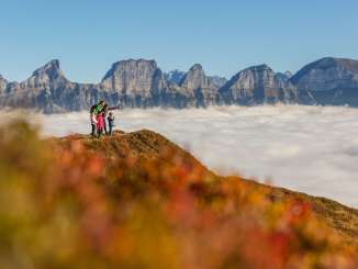 Family on the Flumserberg above the sea of fog
