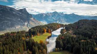 Lake Chapfensee photographed from above in the fall light. The mountains of the Bündner Herrschaft can be seen in the background