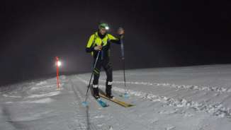 Ski tourers with headlamps on the night-time slopes on the Pizol