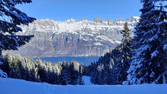View of the snow-covered Churfirsten and Lake Walen