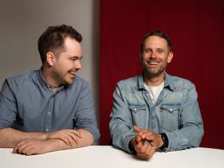 Fabio Nay and Manuel Rothmund sit next to each other and laugh