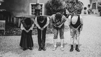 A group of actors bow to the audience