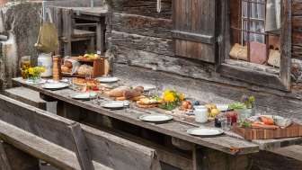 Richly laid table with regional specialties in an alpine hut